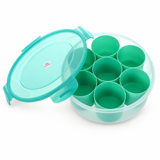 Green round masala dubba with a transparent lid and seven inner compartments.