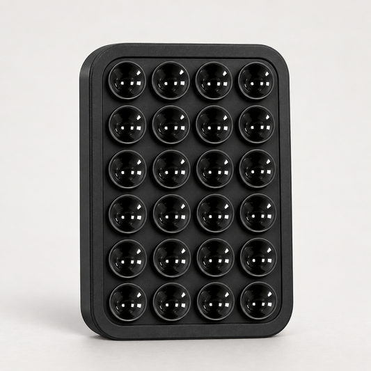 Black square silicone suction phone holder with multiple suction cups.