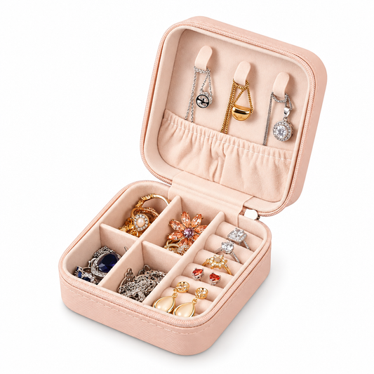 Open light pink zip jewellery storage case with dividers, ring slots and necklace holders.